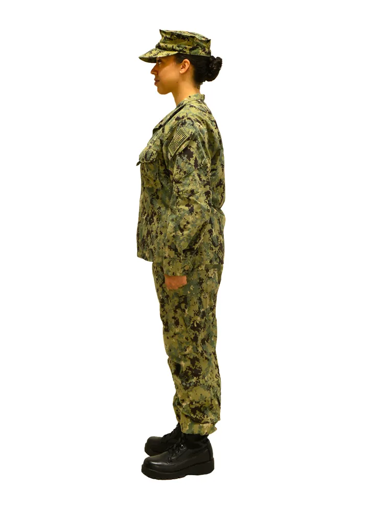 A standing person on a white studio backdrop